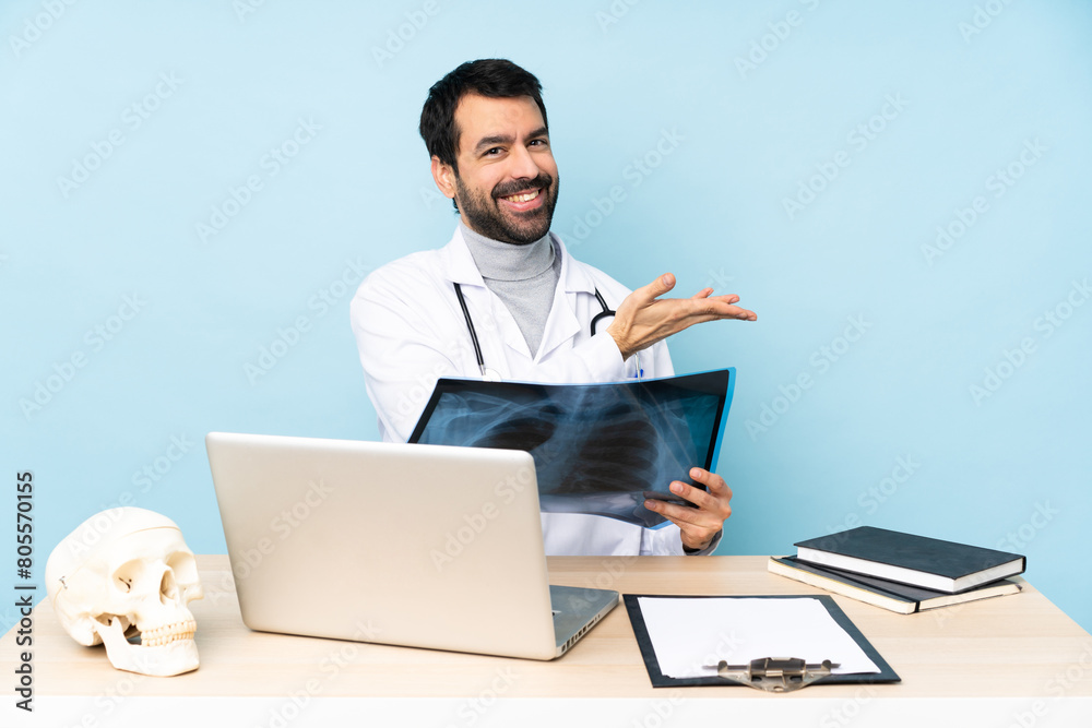 Professional traumatologist in workplace presenting an idea while looking smiling towards