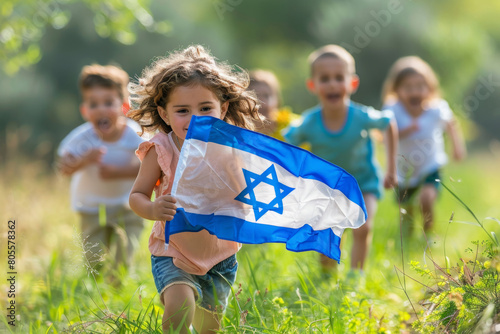 Happy children running with Israeli flag during Independence Day celebration.	
