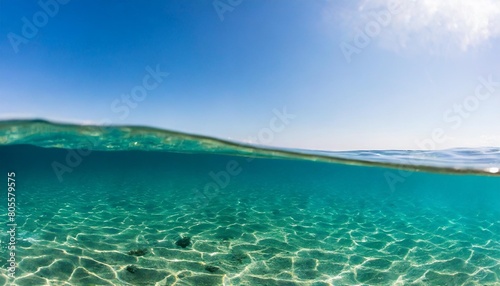 blue sea or ocean water surface and underwater with blue sky © Pauline