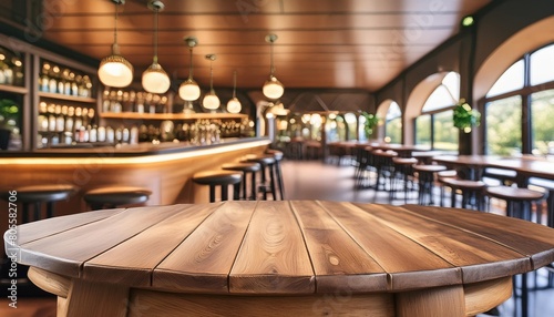 wooden round table and pub or bar blur background