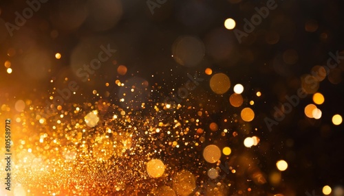 particules scintillantes et brillantes volant sur fond sombre noir lumiere orangee paillettes dorees et flou fond pour banniere creation graphique photo