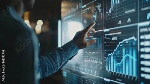 Businessman is touching a virtual screen displaying business data and analytics on a digital display, showcasing advanced financial software for representing company performance.