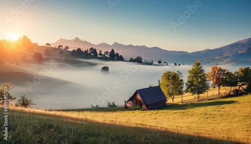 unsurpassed misty morning in the mountains during sunrise amazing nature scenery stunning alpine landscape wonderful counfryside with fog under sunlight picture of wild area natural background