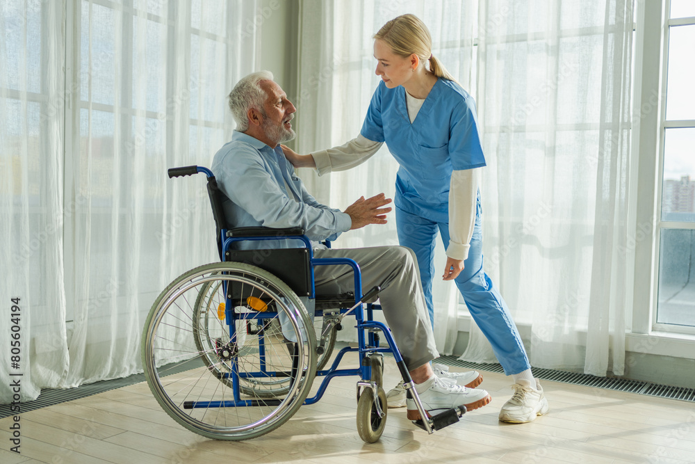 Help support retirement healthcare. Nurse helping old man in wheelchair. Patient and woman in nursing home for medical caregiver. Nurse taking care of paralyzed man in chair for people with disability Help support retirement healthcare. Nurse helping old man in wheelchair. Patient and woman in nursing home for medical caregiver. Nurse taking care of paralyzed man in chair for people with disability