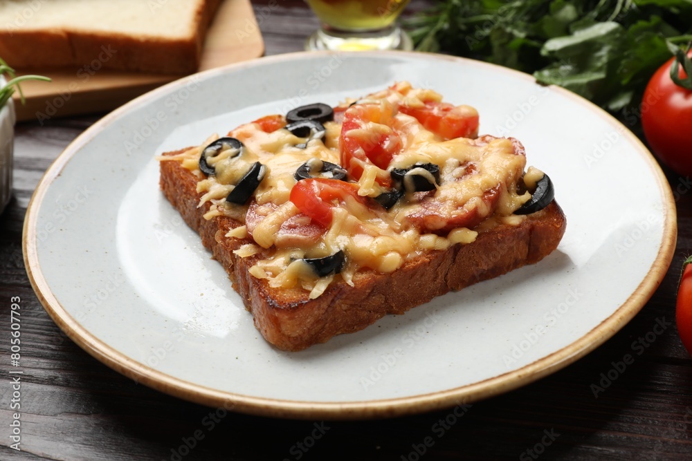 Tasty pizza toast on wooden table, closeup Tasty pizza toast on wooden table, closeup