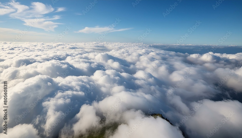 A high altitude cloud view, fluffy clouds creating a soft textured carpet under a bright 