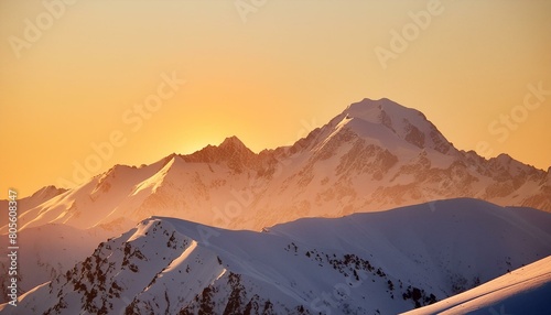 A minimalist mountain scene, snow-capped peaks against a clear sky, shot during the golden 