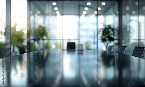 Blurred empty modern office interior with glass walls. Abstract blurred background of a business conference room in the style of a stock photo. © DWN Media
