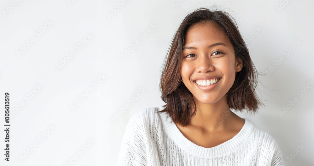 Smiling asian brunette with big smile, wearing a white shirt, in front of a white wall. Flat lay, minimalistic portrait Smiling asian brunette with big smile, wearing a white shirt, in front of a white wall. Flat lay, minimalistic portrait