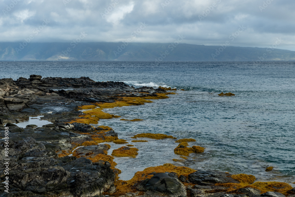 Beautiful Namalu Bay vista along the Kapalua Coastal Trail on Maui, Hawaii, with Molokai Island in the background