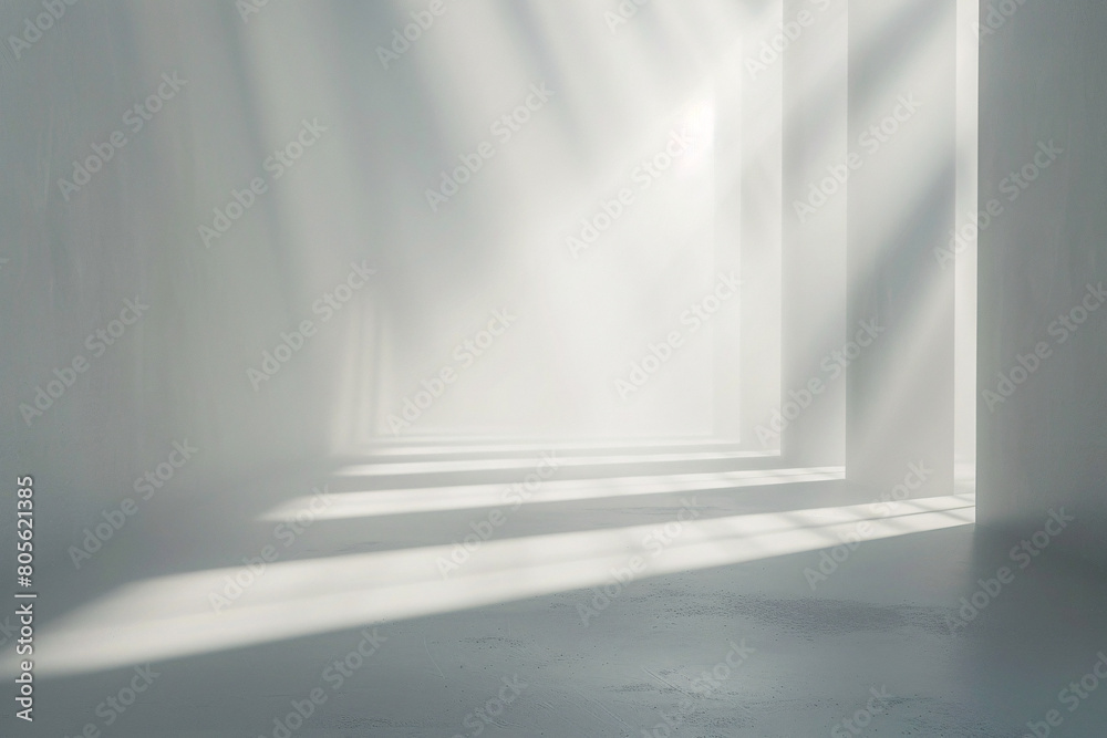 Soft light streaming through a window in a minimalistic white room Soft light streaming through a window in a minimalistic white room