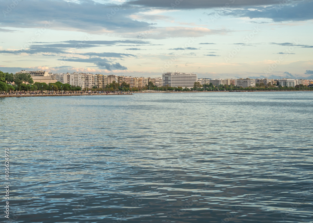 Promenade along Nikis Avenue in Thessaloniki city, Greece. White Tower on background