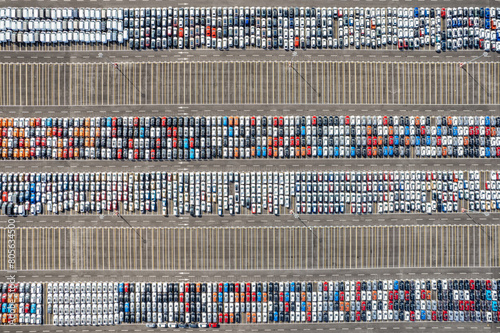 Aerial view of new cars parked for sale in a stock lot row © Mazur Travel