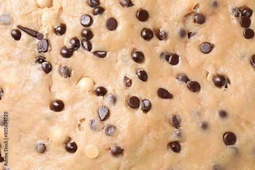 Raw dough with chocolate chips as background, top view © New Africa