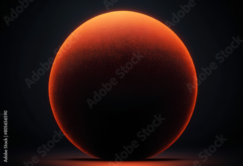 a bright orange ball with the dark background