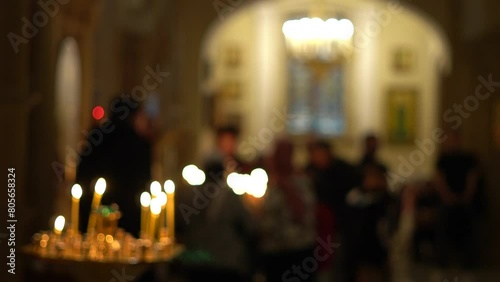 Candles are lit during church services. Christian traditions, holidays photo