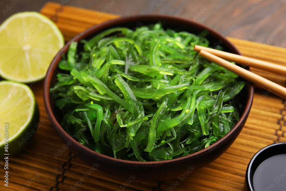 Tasty seaweed salad in bowl served on table, closeup Tasty seaweed salad in bowl served on table, closeup