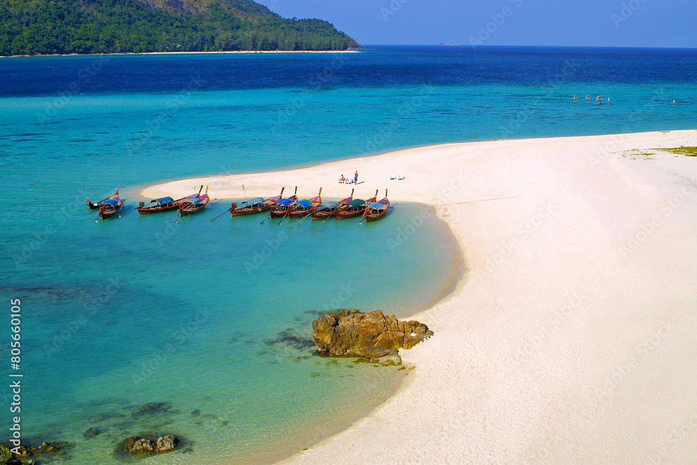 Fish boats on the sand beach on Lipe island in Andaman sea, Thailand