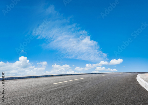 Graphic design asphalt background featuring an empty panoramic road © Supreme
