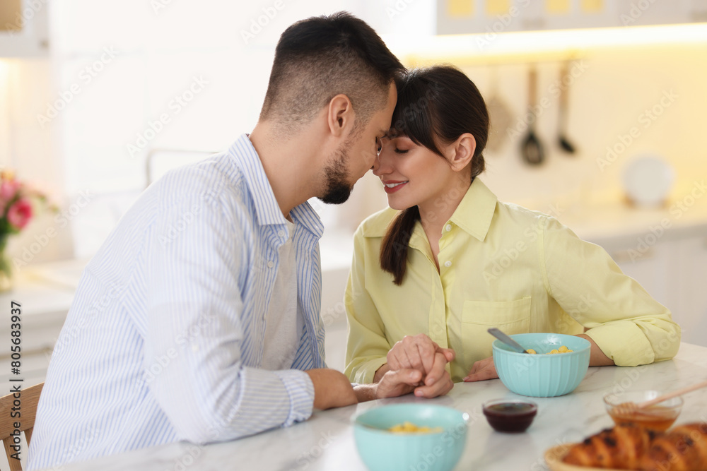 Lovely couple spending time together during breakfast at home Lovely couple spending time together during breakfast at home