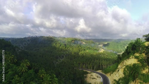 drone lifts off to capture breathtaking aerial footage of the South Coast Road in Tulungagung, East Java, Indonesia. photo