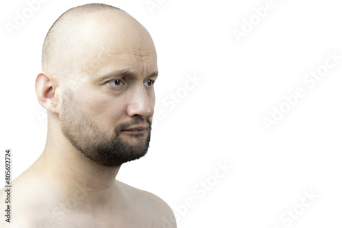 This is a powerful portrait of a man with a beard. He is shirtless, showcasing his physique against a stark white background.