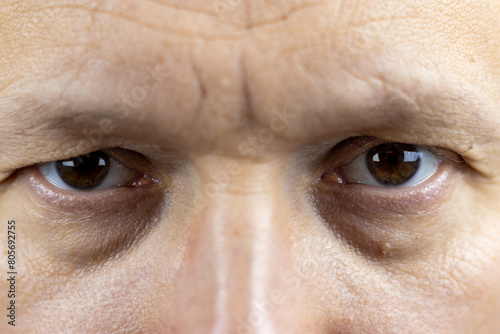Windows to Wisdom: The Intense Gaze of a 45-Year-Old Man photo