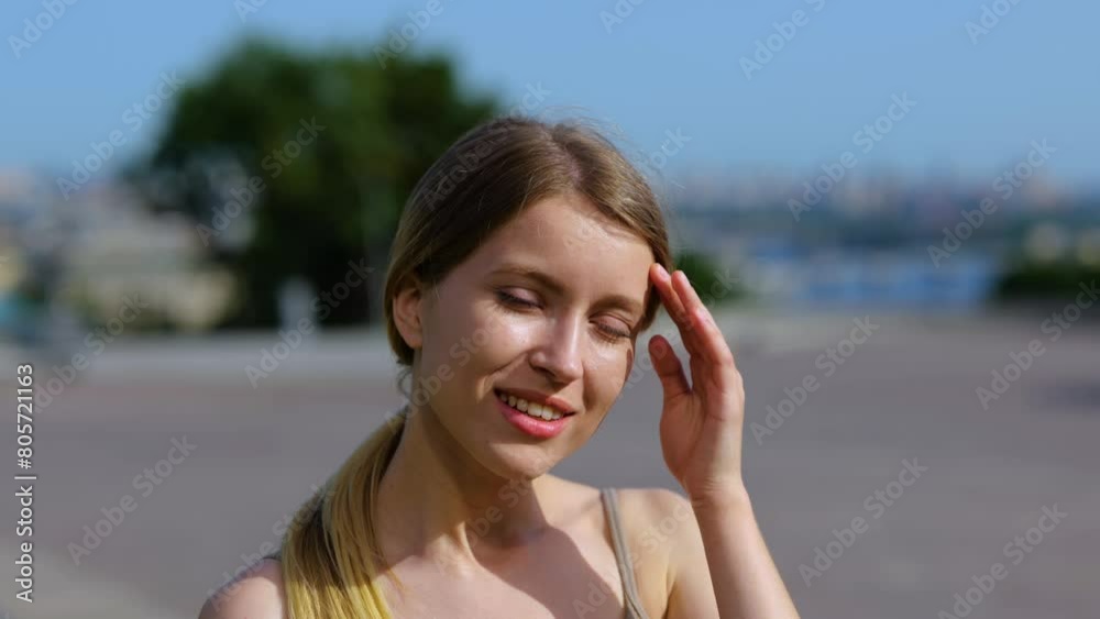 Cheerful young female in good mood looking at camera and smiling. Slow motion Cheerful young female in good mood looking at camera and smiling. Slow motion
