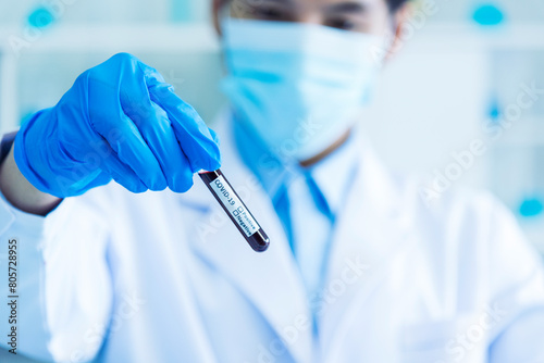 Close up Scientist man hands holding sample blood test tube science laboratory. Doctor clinic healthcare technician lab testing blood sample diagnosis. Crop man scientist hands testing medical lab