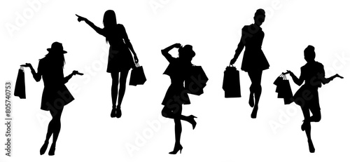Silhouette of  slim young woman carrying shopping bags.