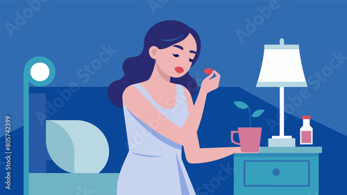 Before turning off her bedside lamp she applies a lip mask to nourish her lips while she sleeps..