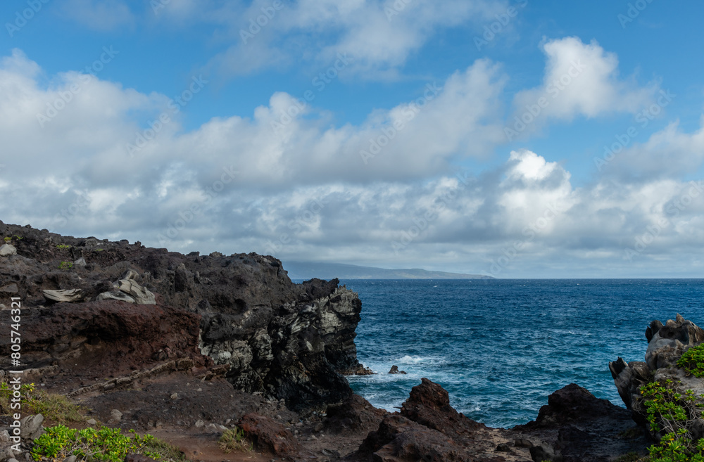 Beautiful Kapalua Coastal Trail vista on Maui, Hawaii, with Molokai Island visible at a distance Beautiful Kapalua Coastal Trail vista on Maui, Hawaii, with Molokai Island visible at a distance