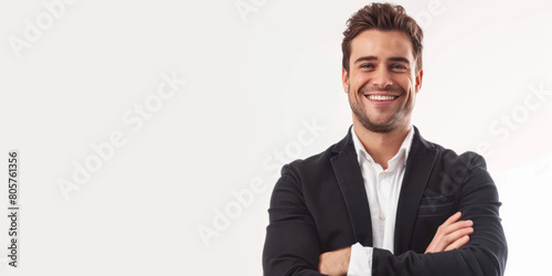 A businessman stands with a smile and arms crossed, isolated on a white background. photo
