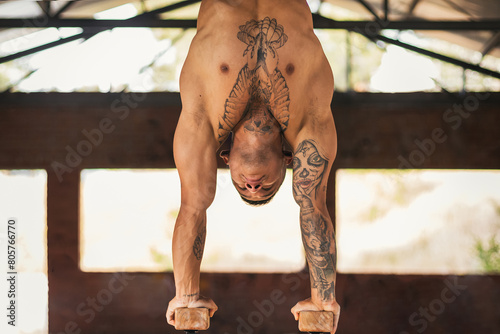 male athlete doing handstand. close-up. calisthenics