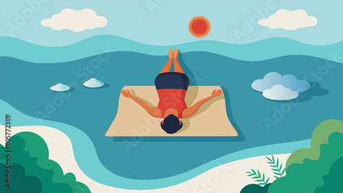 An overhead view of a person in shavasana their body completely relaxed on a yoga mat as they imagine themselves floating on a calm tranquil lake.. photo