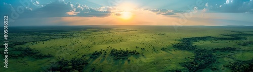 Aerial view of a vast and protected national park with a stunning sunset over the boundless savanna landscape photo
