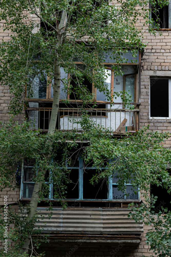 A resettled abandoned apartment building in the city center. A resettled abandoned apartment building in the city center.