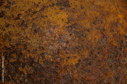 The texture of a metal surface covered with porous rust.
