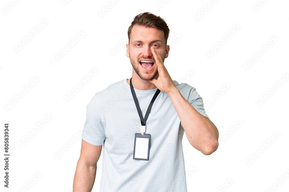 Young caucasian man with ID card over isolated chroma key background shouting with mouth wide open Young caucasian man with ID card over isolated chroma key background shouting with mouth wide open