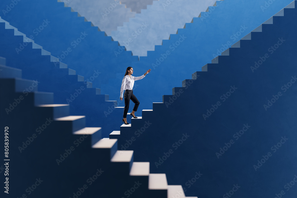 Side view young businesswoman walking on various blue success stairs on light background. Career ladder and promotion concept.