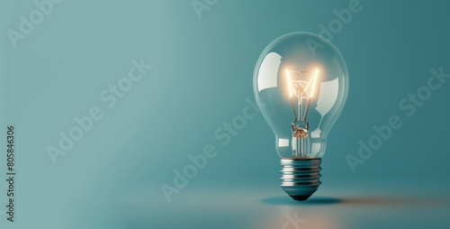 A light bulb, shining on a blue background, vintage modernism, eco-friendly craftsmanship, clever wit, and colors of light cyan and gray.