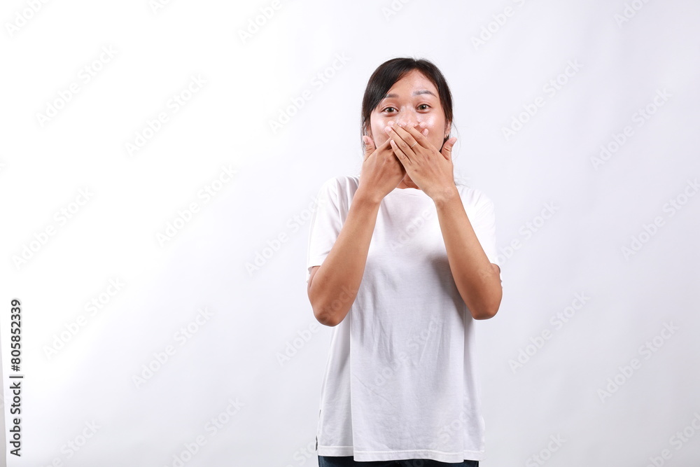 Portrait of shocked young asian girl cover mouth and staring at camera, against white background Portrait of shocked young asian girl cover mouth and staring at camera, against white background