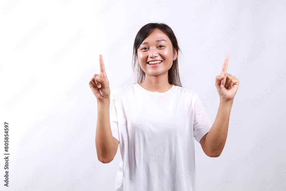 Amused young asian woman introduce new product sharing promo with you, raise hands pointing fingers up smiling broadly, look excited and upbeat, enthusiastic advertising, stand white background Amused young asian woman introduce new product sharing promo with you, raise hands pointing fingers up smiling broadly, look excited and upbeat, enthusiastic advertising, stand white background