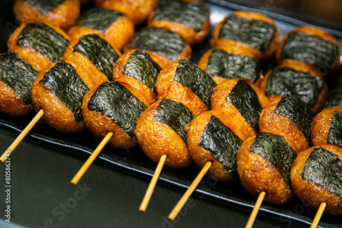Yaki Onigiri are Japanese rice balls that are pan-grilled and glazed in savory soy sauce. 