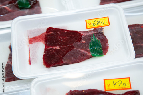 Cut of whale meat at an Osaka fish market in Japan.