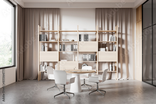 Beige board room interior with bookcase