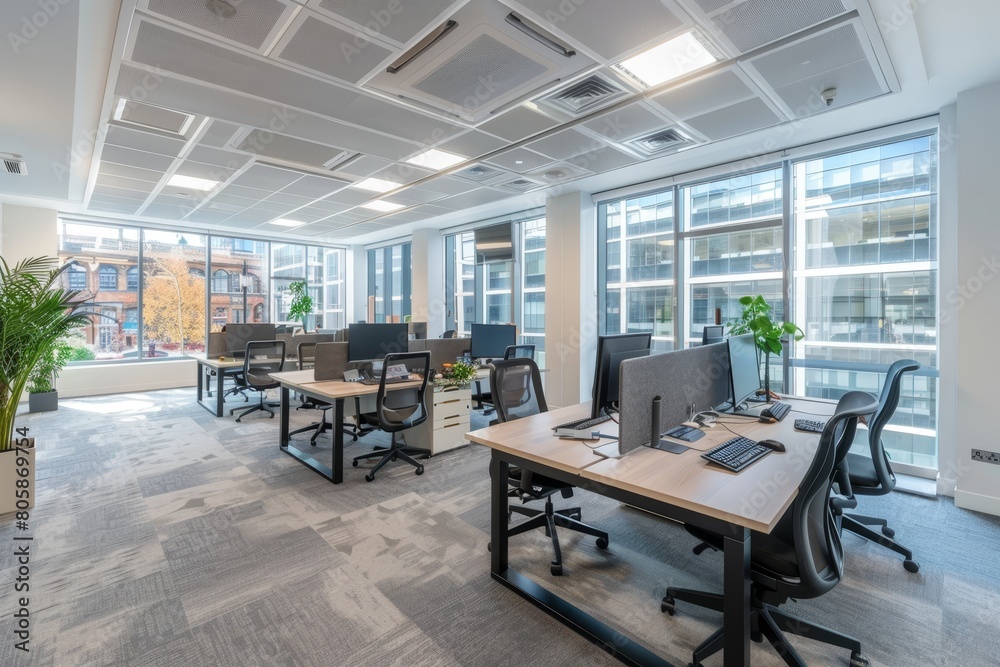 Modern bright office space fully set-up with desks and workstations for productive work environment