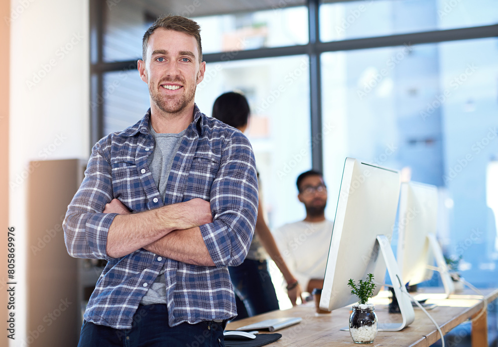 Portrait, business and man with arms crossed, smile and confidence with graphic designer, modern office and proud. Face, people and entrepreneur with computer, career ambition and startup with tech