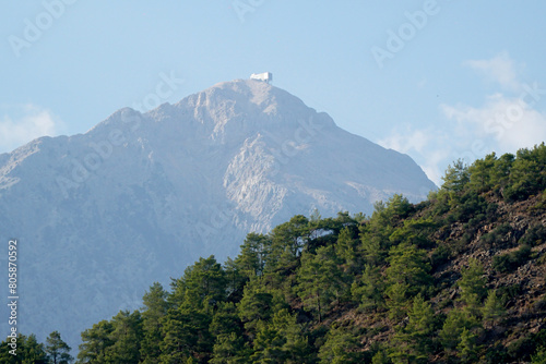 View from the forest to the top of Tahtali mountain in Turkey photo