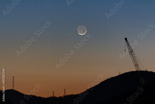 夕焼け空に薄い月 photo